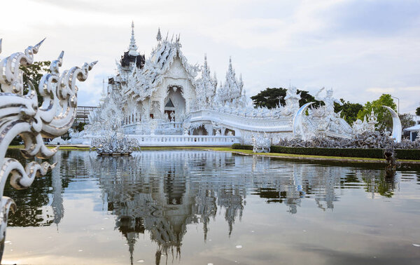 Chiangrai, Thailand - September 01, 2018: Wat Rong Khun (White Temple) is one of most favorite landmarks tourists visit in Thailand, built with modern contemporary unconventional Thai Buddhist arts.