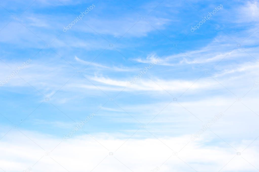  Blue background in the sky with white clouds.