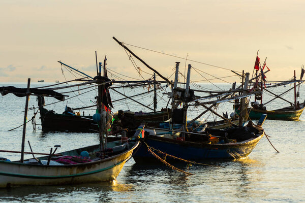 Morning sunshine with a boat in the sea.