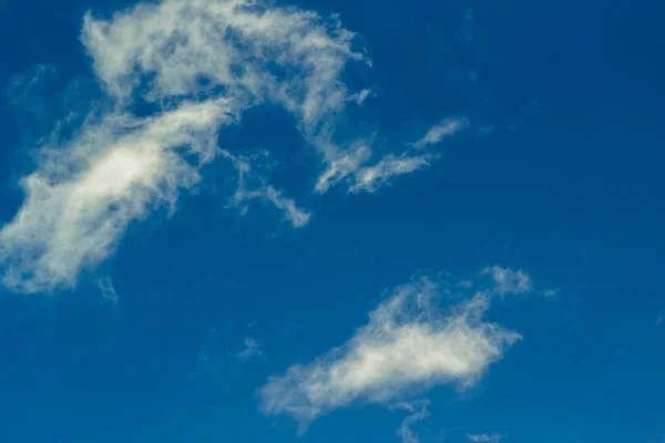 The white clouds in the sky are the natural forces that are so much more difficult than the perfect technology to mimic.