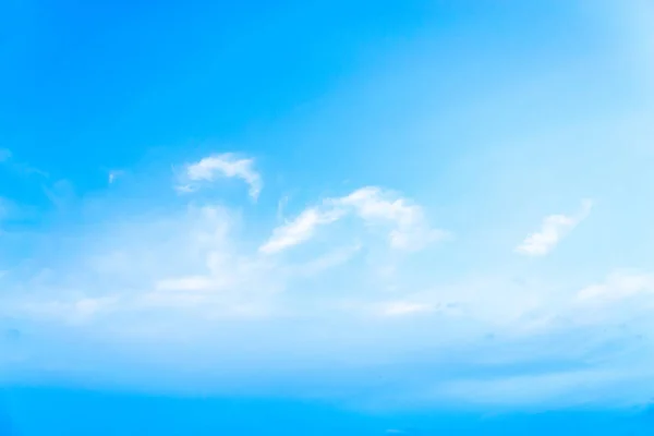 Blue sky with white clouds at noon.