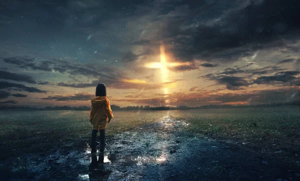 Little Girl Stands Rain Glowing Cross Sky — Stock Photo, Image