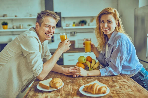 Romantic young couple cooking together in the kitchen, having a great time together. — Stock Photo, Image