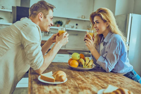 Romantic young couple cooking together in the kitchen, having a great time together. — Stock Photo, Image