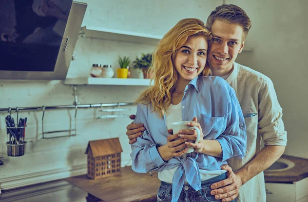 Romantic young couple cooking together in the kitchen, having a — Stock Photo, Image