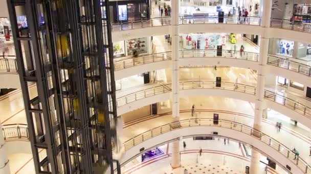 Mall round hall with glass lifts time-lapse. pan up — Stock Video