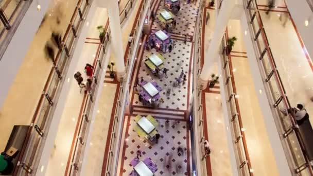 Shopping mall traffic time-lapse from top. pan up — Stock Video