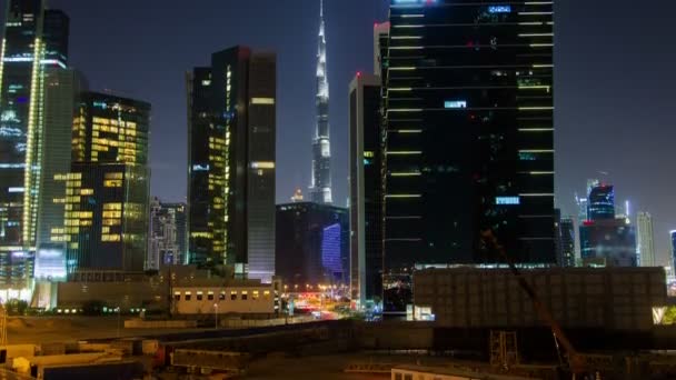 Хмарочоси в бізнес Бей Downtown Dubai ніч проміжок часу. Пан вгору — стокове відео