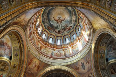 MOSCOW, RUSSIA - June 28, 2018Interior decoration of Cathedral of Christ the Savior with a spectacular ceiling of its central dome (cupola).  clipart