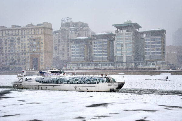 MOSCOW, RUSSIA - January 26, 2019View from the embankment of Tarasa Shevchenko on the ice-breaker cruiser "Ferdinand" of the Radisson Royal Flotilla on the River Moskva in the heavy snowfall.