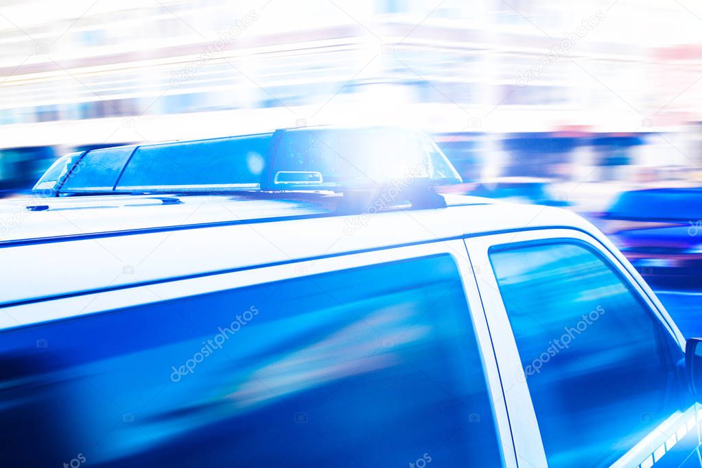 flashing blue lights on police car