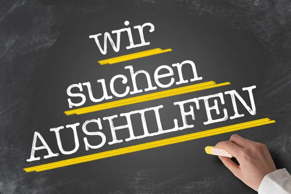 Testo WIR SUCHEN AUSHILFEN, German for Help Wanted, scritto sulla lavagna — Foto Stock