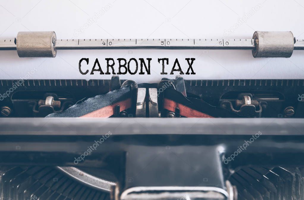 text CARBON TAX written on vintage typewriter
