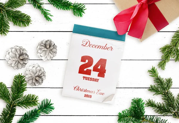 tear-off calendar on December 24 Christmas Eve 2019 on white wooden table