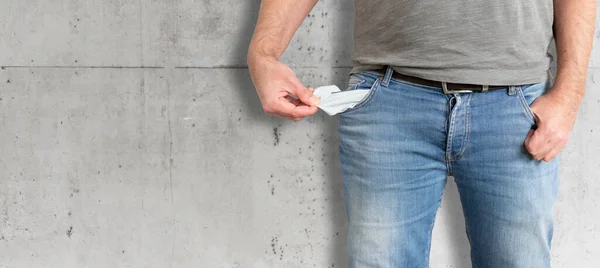Midsection of man showing his empty pockets — Stock Photo, Image