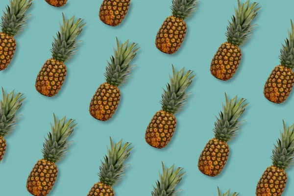 Pineapple fruit pattern on a dark turquoise background