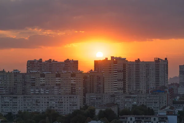 urban landscape with high-rise buildings on the background of a magnificent bright sunset. Krasnodar, Russia