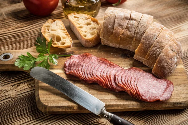 Italian Ciabatta Bread Cut Slices Wooden Chopping Board Salami — Stock Photo, Image
