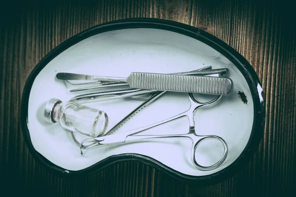 Old medicine equipment on wooden background. Vintage style.