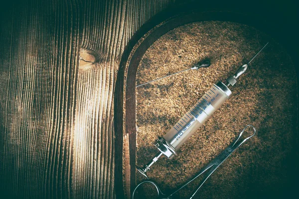 Old medicine equipment on wooden background. Vintage style.