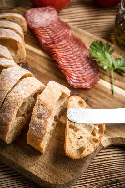 Italian Ciabatta Bread Cut Slices Wooden Chopping Board Salami — Stock Photo, Image