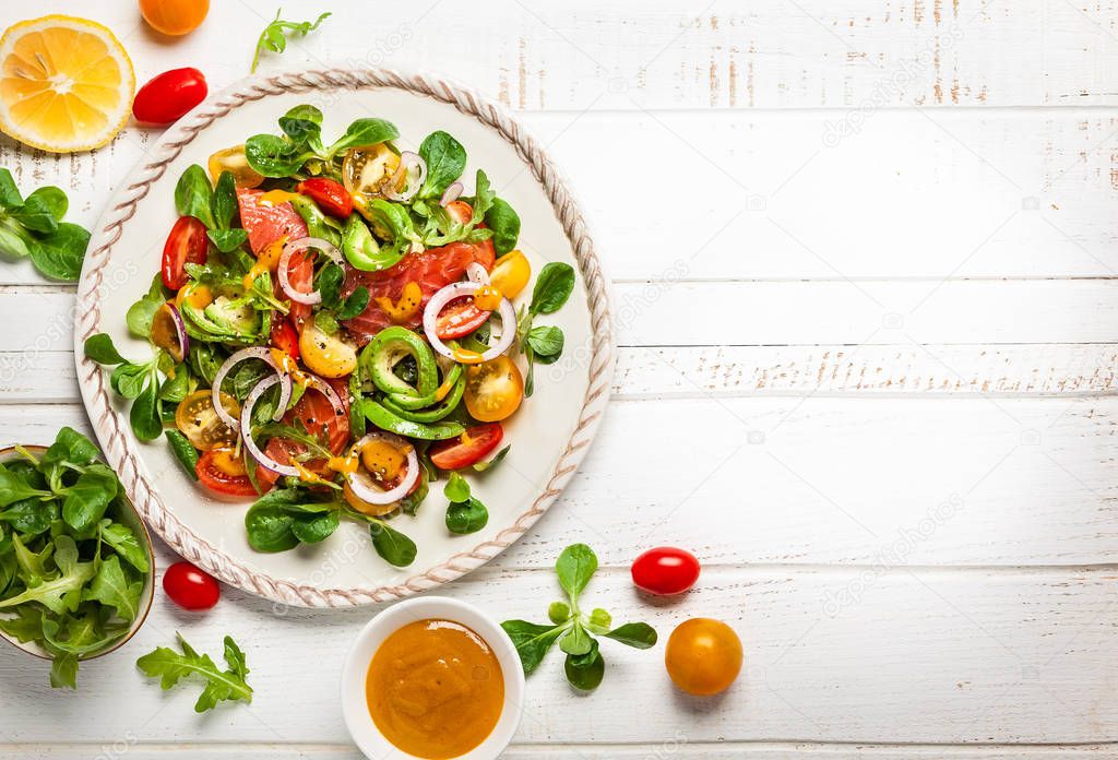 Smoked salmon, avocado and cherry tomatoes salad with honey mustard dressing