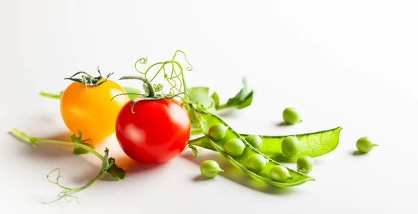 Fresh green  peas pods with sprouts and cherry tomatoes — Stock Photo, Image