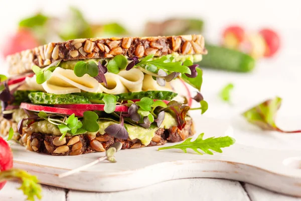 Fresh vegetarian  sandwich  with cheese and veggies.