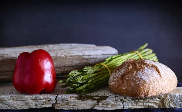 Mediterranean diet. Bread with vegetables composition in a wooden table