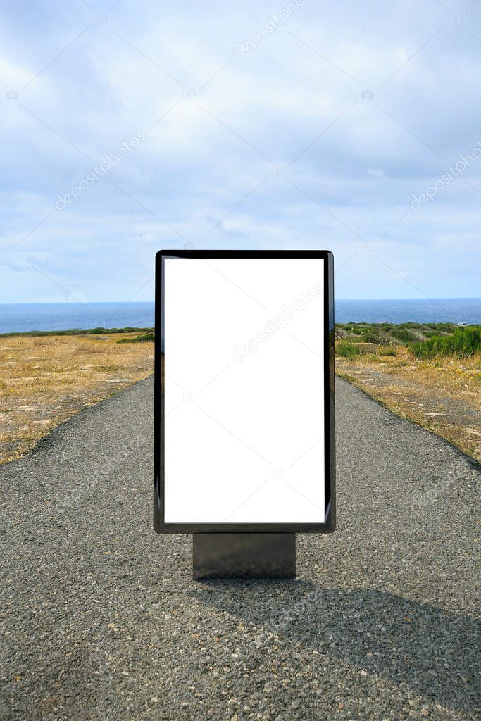 Poster billboard on the road to a lighthouse .Blank advertising billboard mockup in the street