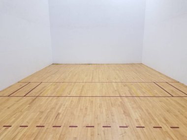 wooden floor on racketball court with white wall clipart