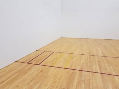 red tape on wooden floor with white walls in racquetball court clipart