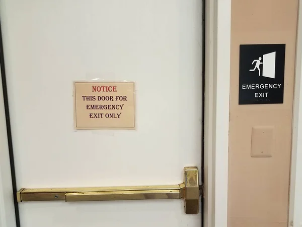 emergency exit sign on door and wall