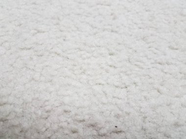 Bulanık beyaz bir halı ya da yakından halı.