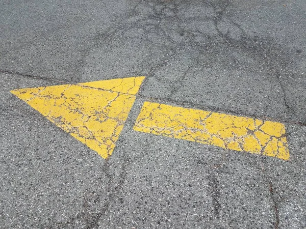 Yellow Pointer Arrow Black Asphalt Cracks Damage — 스톡 사진
