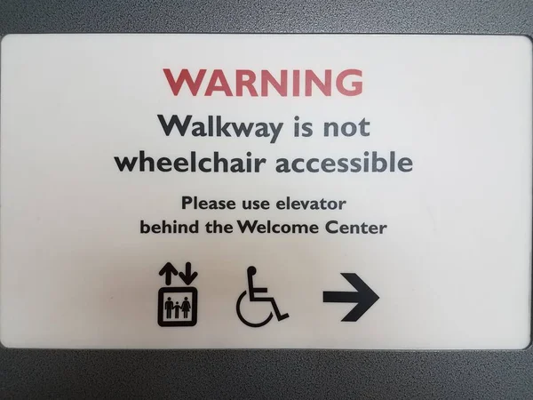 a warning walkway is not wheelchair accessible sign