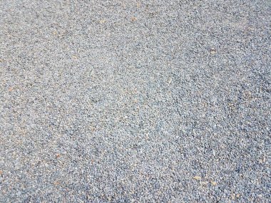 Küçük gri ve mavi çakıl taşları ya da yerdeki çakıllar ya da arka plan