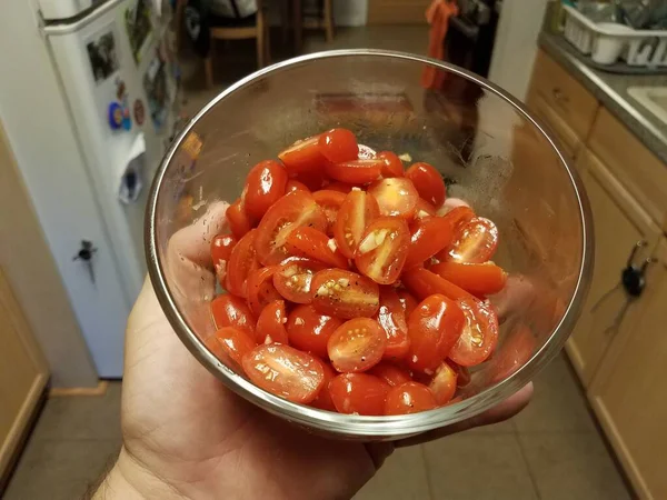 Hand Holding Cut Red Cherry Tomatoes Glass Container Kitchen — Stock Photo, Image