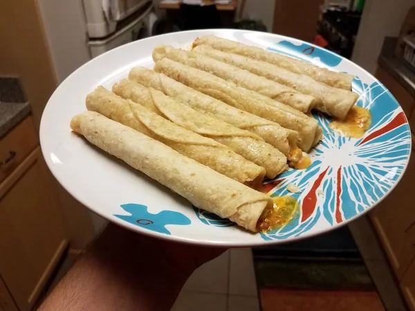 Hand Holding Hot Taquitos Plate Kitchen — Stock Photo, Image