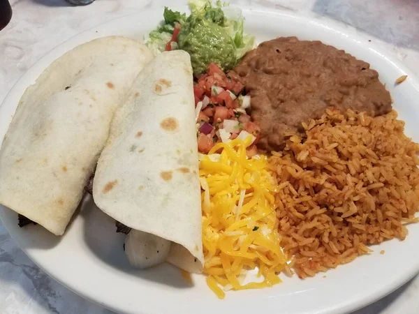 Two Tacos Rice Beans Cheese Avocado Plate — ストック写真