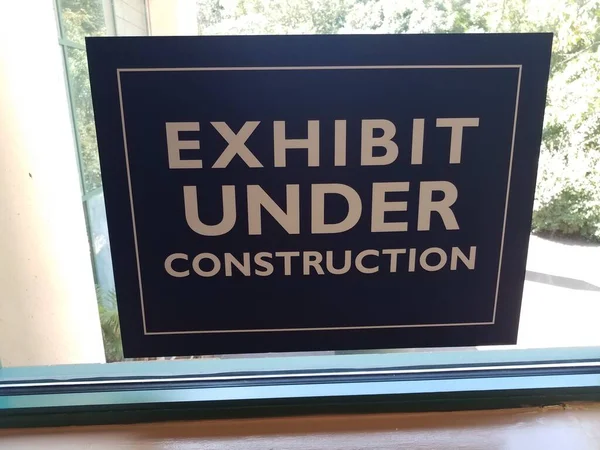 Exhibit Construction Sign Glass Window Pane — Stock Photo, Image
