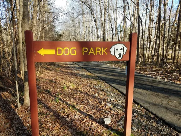 Wood Dog Park Sign Yellow Arrow Asphalt Trail Path Trees — 스톡 사진