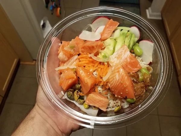 Hand Holding Plastic Container Raw Salmon Avocado Rice Kitchen — Stock Photo, Image