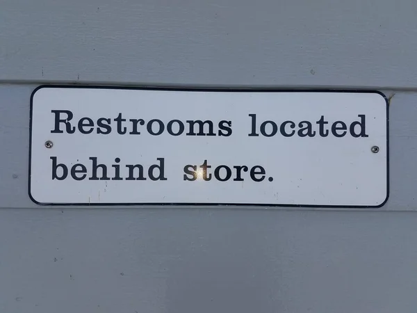 Restrooms Located Store Sign Wall — Stock Photo, Image