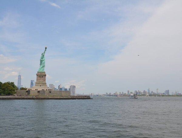 Statue of liberty monument and river water in New York city