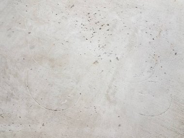 Gri beton zemin ya da zemin üzerindeki dairesel ya da sarmal hasar