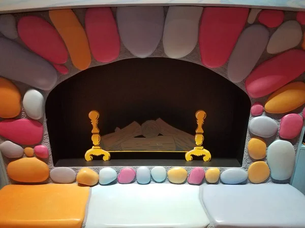 Colorful Fake Fireplace Mantel Hearth Logs — Stock Photo, Image