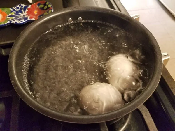 Dos Huevos Hirviendo Una Olla Agua Estufa —  Fotos de Stock