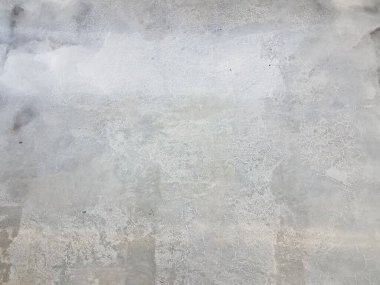 Gri yıpranmış beton zemin ve bir sürü küçük çatlaklar.