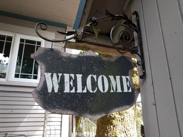 Weathered Worn Black Metal Welcome Sign Hanging Wall Hook — Stock Photo, Image